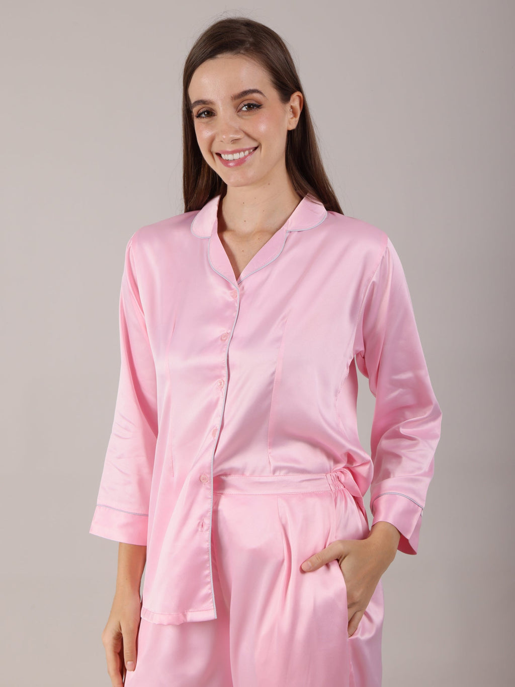 Women's Pajama Set in baby pink color in soft silk satin fabric with long pajamas fitted with deep pockets.
