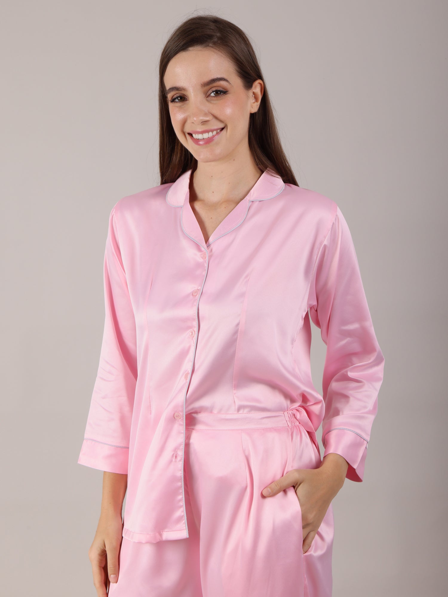 Women's Pajama Set in baby pink color in soft silk satin fabric with long pajamas fitted with deep pockets.