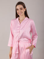 Women's Pajama Set in baby pink color in soft silk satin fabric with long pajamas fitted with deep pockets.