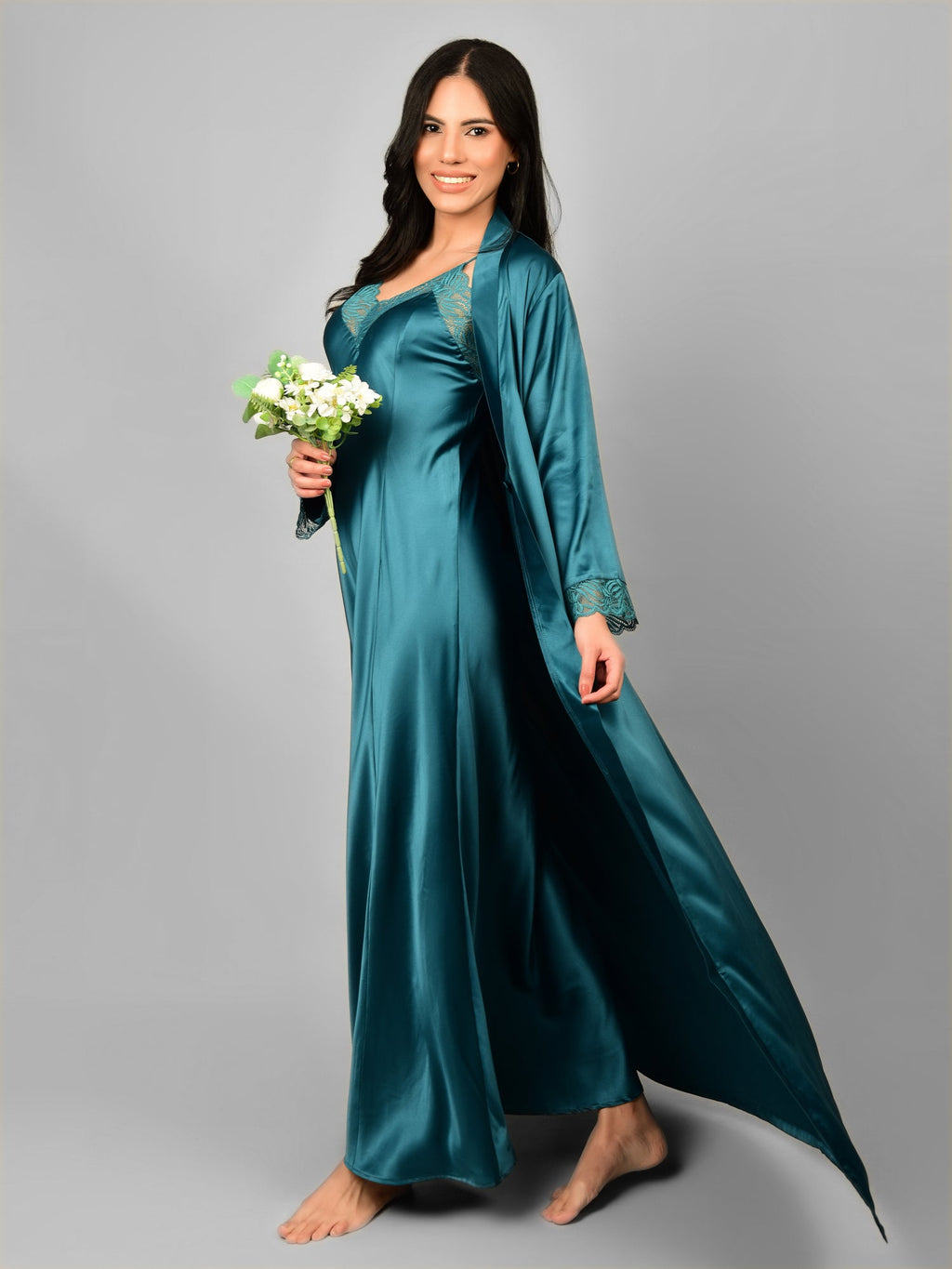 Woman wearing Emerald satin nightwear with robe.