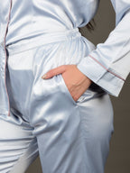 This is a close up of the ice blue night suit which shows the garment has deep pockets for extra comfort and also has elasticated waistband for a more comfortable pajama fit.