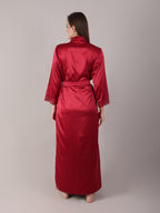 Red satin robe worn by a person on a plain background for more coverage and comfort.