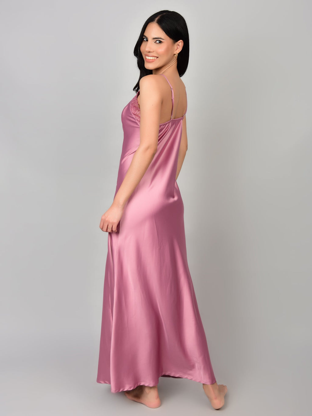Woman wearing Rosete satin nightwear with robe